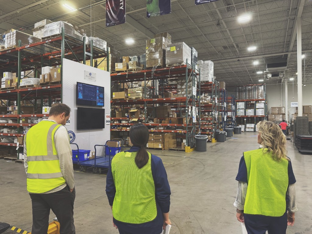 Team observing operations on the warehouse floor